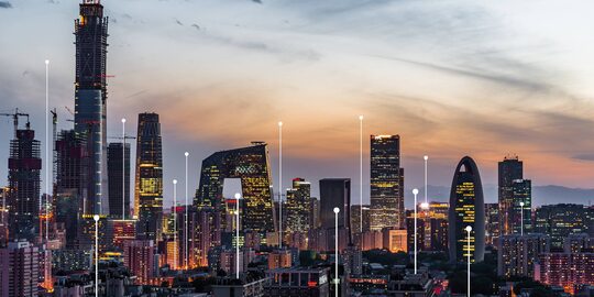 Illuminated skyscrapers with key points positioned in the middle of the city